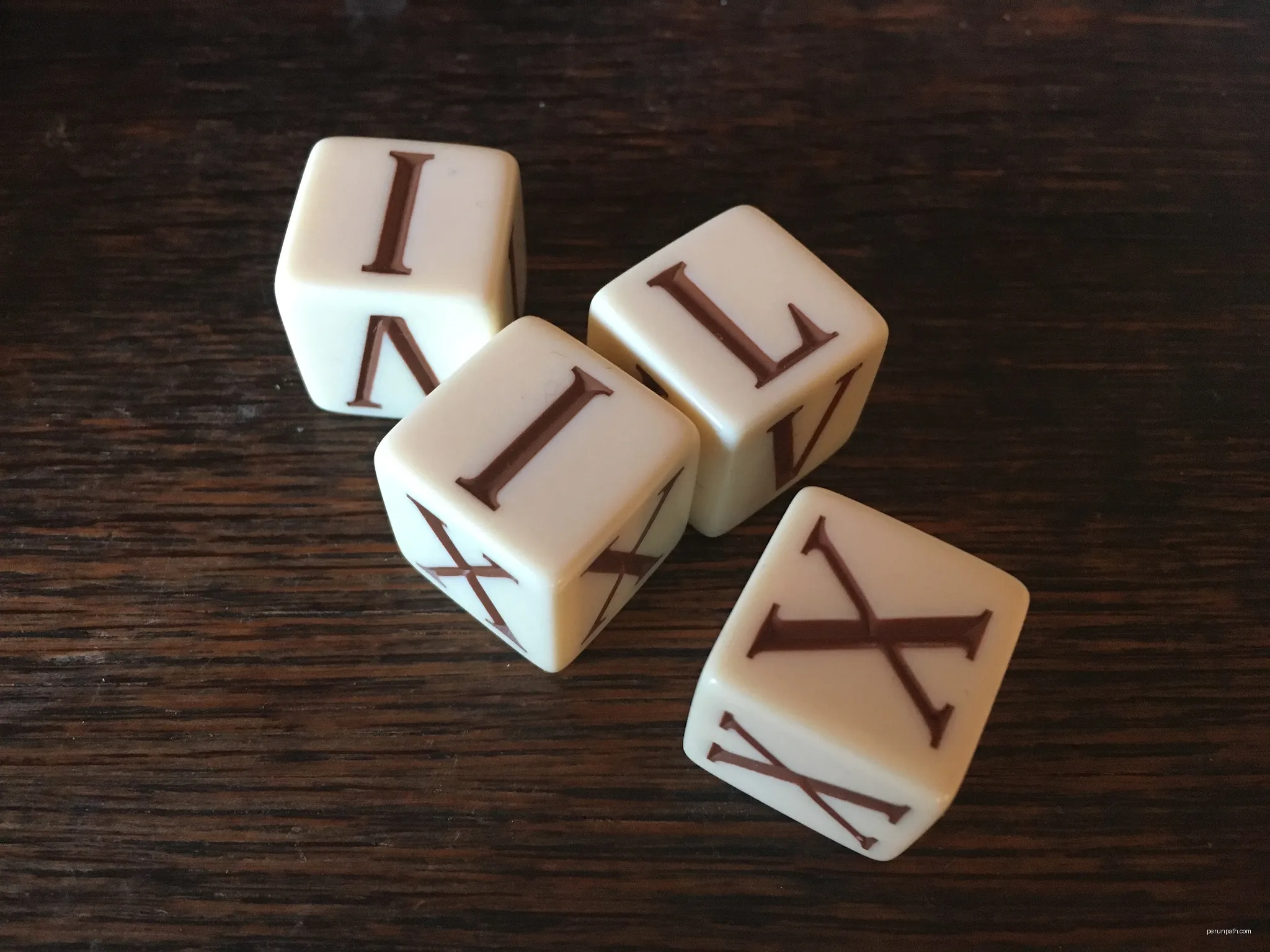 : a dice game with ancient roman numbers | Autor: Achim Raschka | Licencja: CC BY-SA 4.0 | Źródło: Wikimedia Commons